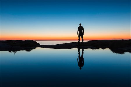 dawn silhouettes - Silhouette of man at coast Stock Photo - Premium Royalty-Free, Code: 6102-07844264
