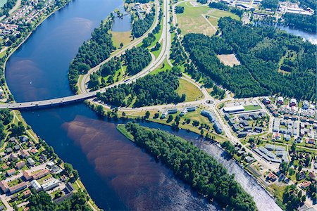 Aerial view of river flowing through city Stock Photo - Premium Royalty-Free, Code: 6102-07844310