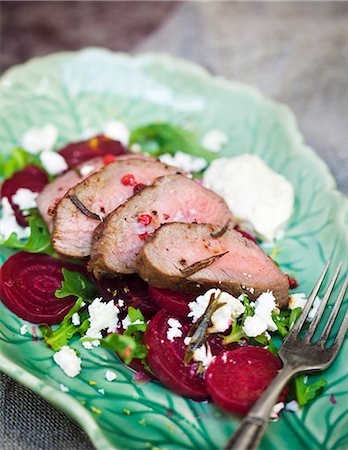 Sliced meat on beetroot salad Stock Photo - Premium Royalty-Free, Code: 6102-08062890