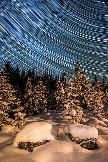 Winter landscape with star trails Stock Photo - Premium Royalty-Free, Image code: 6102-08063063