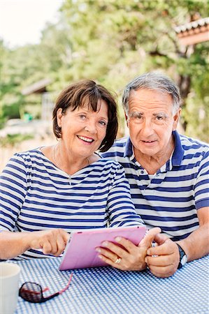 Mature couple using digital tablet Stock Photo - Premium Royalty-Free, Code: 6102-08063010