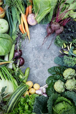 Various vegetables against concrete background Stock Photo - Premium Royalty-Free, Code: 6102-08000567