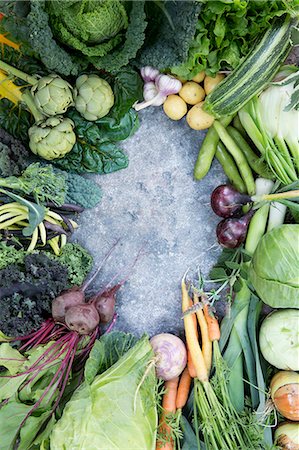 Various vegetables against concrete background Stock Photo - Premium Royalty-Free, Code: 6102-08000566