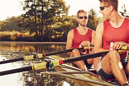 Young men canoeing Stock Photo - Premium Royalty-Free, Code: 6102-08000681