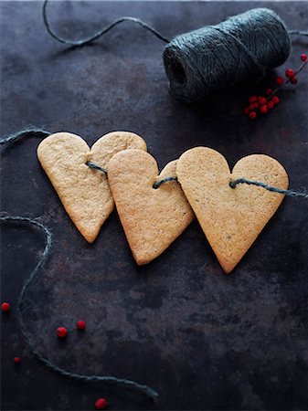 simsearch:6102-07282667,k - Heart shaped cookies on string Stock Photo - Premium Royalty-Free, Code: 6102-08000998