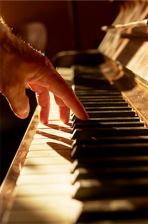 Mans hand playing piano Stock Photo - Premium Royalty-Free, Code: 6102-08001201