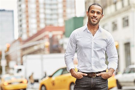 road buildings traffic day - Portrait of smiling man Stock Photo - Premium Royalty-Free, Code: 6102-08001321