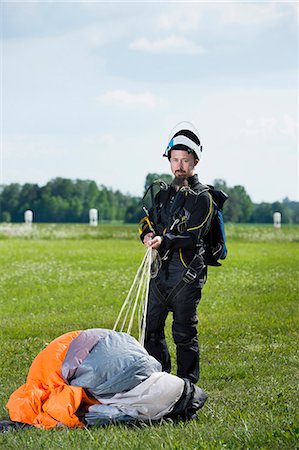 simsearch:6102-07789826,k - Sky-diver on airport after safe landing Stock Photo - Premium Royalty-Free, Code: 6102-08001445