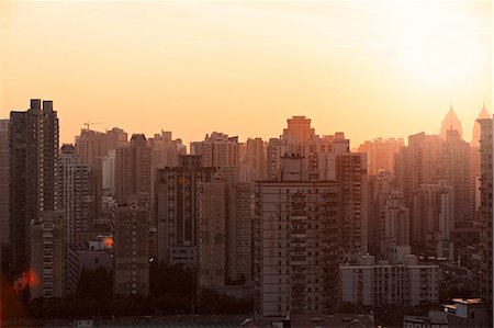 simsearch:6102-08001493,k - Cityscape at sunset Foto de stock - Sin royalties Premium, Código: 6102-08001495