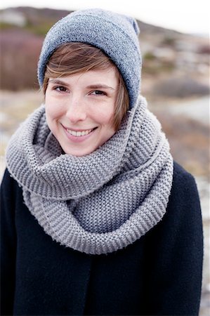 smiling in the wind with scarf - Portrait of young woman Stock Photo - Premium Royalty-Free, Code: 6102-08168884