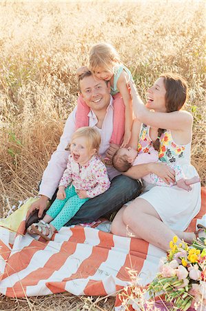 five girl babies - Happy family in meadow Stock Photo - Premium Royalty-Free, Code: 6102-08168807