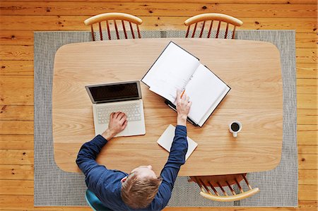 people high angle - Man using laptop, directly above Stock Photo - Premium Royalty-Free, Code: 6102-08168834