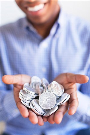 simsearch:6102-08168957,k - Man holding silver coins Stock Photo - Premium Royalty-Free, Code: 6102-08168951