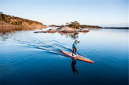 paddle board man - Person on paddleboard Stock Photo - Premium Royalty-Free, Code: 6102-08169056