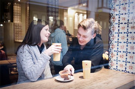 simsearch:6102-08062968,k - Young couple in cafe Stock Photo - Premium Royalty-Free, Code: 6102-08183927