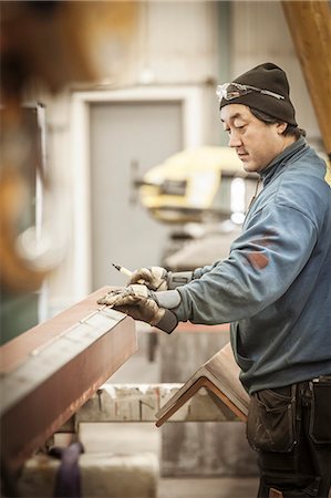 Man working in workshop Stock Photo - Premium Royalty-Free, Code: 6102-08184016