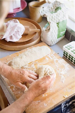 Hands kneading bread dough Stock Photo - Premium Royalty-Free, Code: 6102-08120141