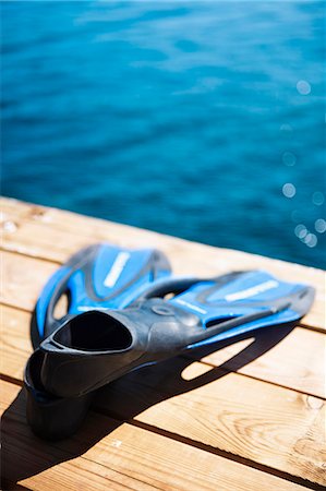 simsearch:6102-08120131,k - Diving flippers on jetty Photographie de stock - Premium Libres de Droits, Code: 6102-08120129