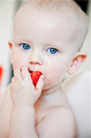 stockholm eat - Portrait of baby boy eating strawberry Stock Photo - Premium Royalty-Free, Code: 6102-08120458