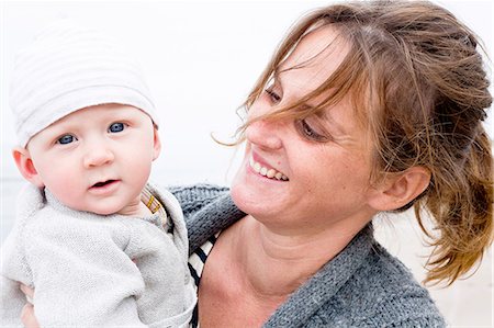 portrait parent - Smiling mother with baby boy Stock Photo - Premium Royalty-Free, Code: 6102-08120474