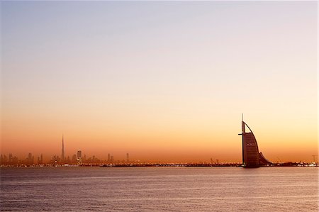 dubai skylines - Burj al Arab at sunset Stock Photo - Premium Royalty-Free, Code: 6102-08120476