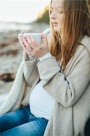 european adult beach photos - Young woman having drink on beach Stock Photo - Premium Royalty-Free, Code: 6102-08120662