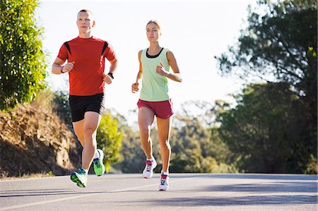 exercising - Young couple jogging Stock Photo - Premium Royalty-Free, Code: 6102-08120697
