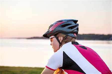 female triathlon - Young woman cycling Stock Photo - Premium Royalty-Free, Code: 6102-08120837