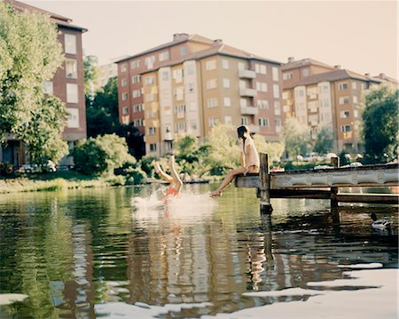 diving (jumping into water) - Couple having a swim Photographie de stock - Premium Libres de Droits, Code: 6102-08120971