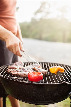 Man having barbecue Stock Photo - Premium Royalty-Free, Code: 6102-08121005