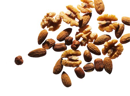 simsearch:6102-08942324,k - Nuts on white background Foto de stock - Sin royalties Premium, Código: 6102-08270677