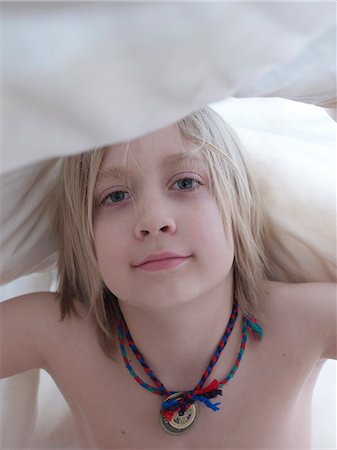 shirtless, boy - Portrait of boy under blanket Stock Photo - Premium Royalty-Free, Code: 6102-08270692