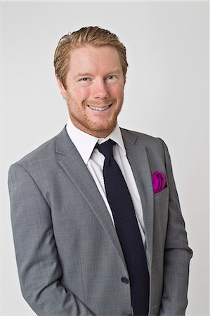 simsearch:6102-08746896,k - Portrait of man wearing suit, studio shot Photographie de stock - Premium Libres de Droits, Code: 6102-08270624