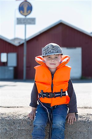 Boy wearing life jacket Stock Photo - Premium Royalty-Free, Code: 6102-08270779