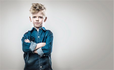 simsearch:6102-08270959,k - Boy with crossed arms Stock Photo - Premium Royalty-Free, Code: 6102-08270730