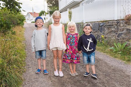 simsearch:6102-08001456,k - Children standing together and looking at camera Stock Photo - Premium Royalty-Free, Code: 6102-08270846