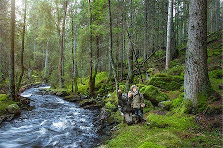 Boy with father in forest Stock Photo - Premium Royalty-Free, Code: 6102-08270816