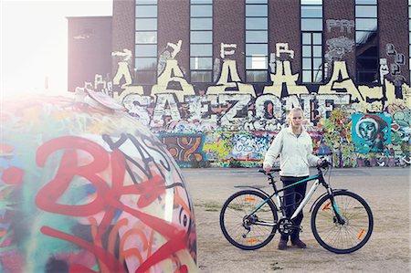 sweden graffiti - Teenage girl with bicycle Stock Photo - Premium Royalty-Free, Code: 6102-08270980