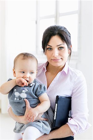 simsearch:6102-08942558,k - Businesswoman with baby girl in office Stock Photo - Premium Royalty-Free, Code: 6102-08271017