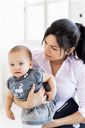 simsearch:6102-08942558,k - Businesswoman with baby girl in office Stock Photo - Premium Royalty-Free, Code: 6102-08271015