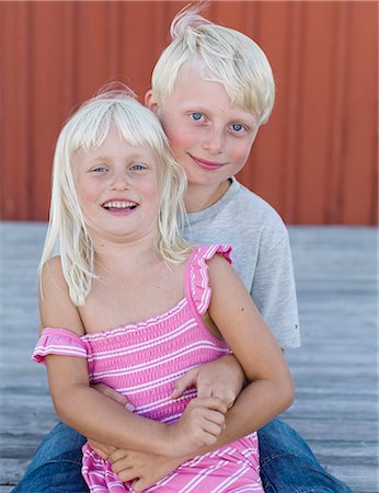 Brother and sister sitting together Stock Photo - Premium Royalty-Free, Code: 6102-08271102