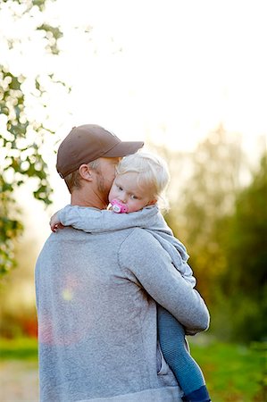 simsearch:6102-07602586,k - Girl hugging father Stock Photo - Premium Royalty-Free, Code: 6102-08271507