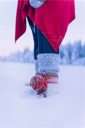 sweden, winter - Womans boots with pom pom Stock Photo - Premium Royalty-Free, Code: 6102-08271670