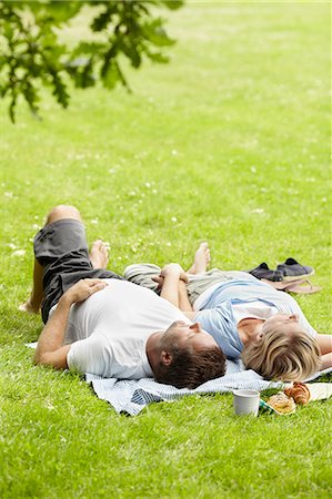 simsearch:6102-08747067,k - Couple relaxing in park Stock Photo - Premium Royalty-Free, Code: 6102-08271771