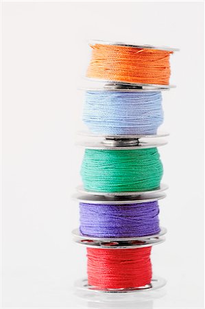 simsearch:6102-03748482,k - Stacks of spools of multicolor thread Photographie de stock - Premium Libres de Droits, Code: 6102-08278710