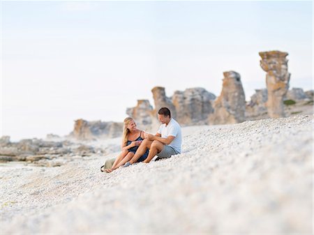 Couple on rocky beach Stock Photo - Premium Royalty-Free, Code: 6102-08278891