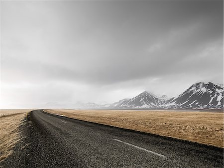 snowcapped mountains with a road - Country road Stock Photo - Premium Royalty-Free, Code: 6102-08278976