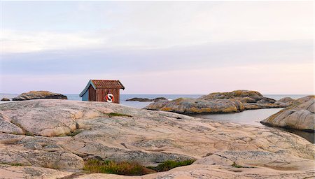 simsearch:6102-08278713,k - Wooden shed on rocky coast Stock Photo - Premium Royalty-Free, Code: 6102-08278920