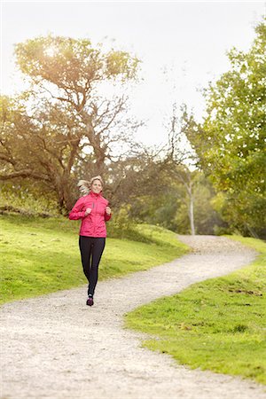 simsearch:6102-08481170,k - Woman jogging Foto de stock - Royalty Free Premium, Número: 6102-08384037