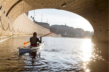 simsearch:6102-08062947,k - Man kayaking on sea Stock Photo - Premium Royalty-Free, Code: 6102-08384236